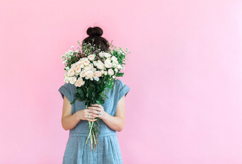 Girl holding flowers