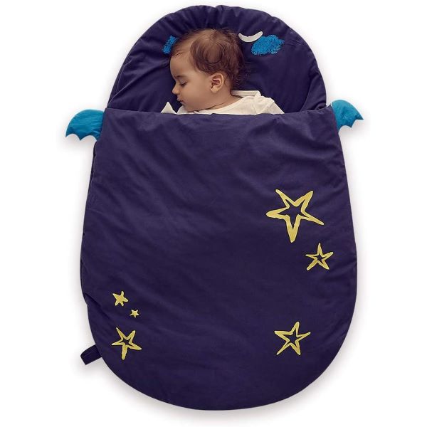baby sleeping in blue sleeping bag with star design baby shower gift ideas
