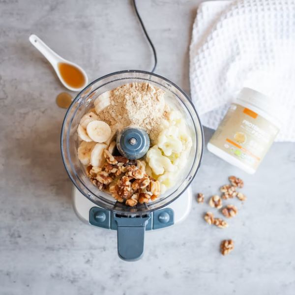 cereal, bananas and walnuts in a food processor