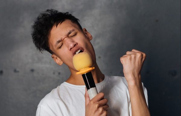 man singing karaoke microphone
