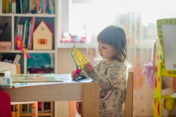 kid young girl cutting handmade father's day card