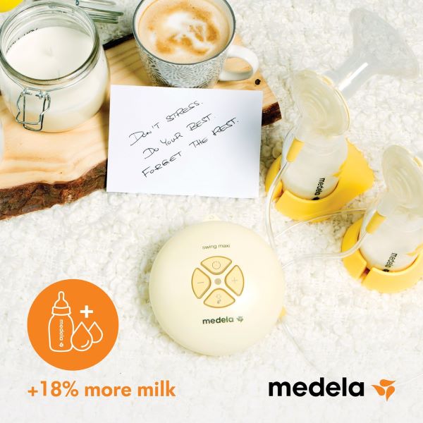 medela swing maxi double electric breast pump flat lay with glass of milk best singapore
