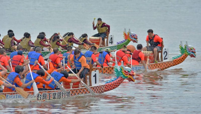 multiple dragon boats during dragon boat festival