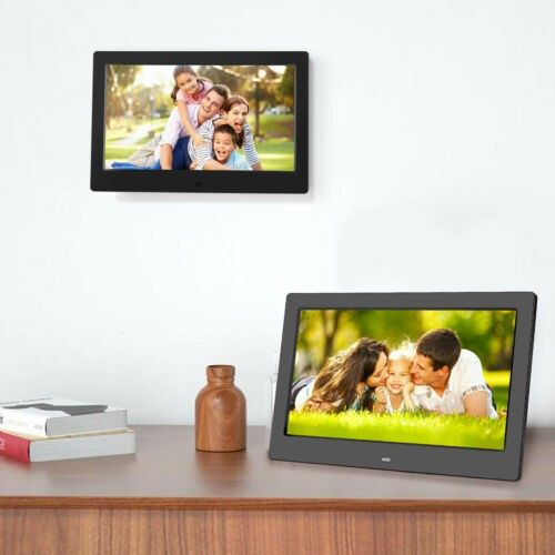 digital photo frame hanging on wall and displayed on wooden shelf