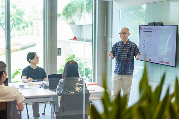 Thomas presenting during a meeting