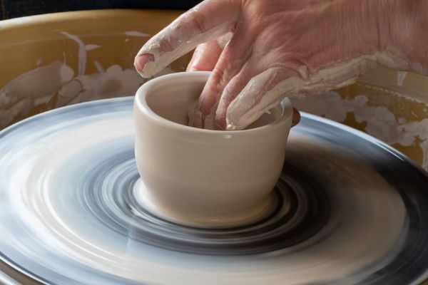 person molding clay mother's day activities