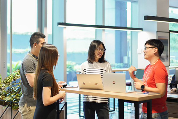 Sunny and Eric having a discussion with their colleagues