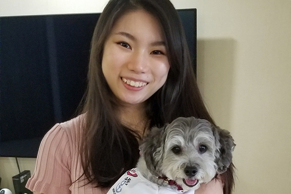 Vanessa with her toy poodle, Bailey