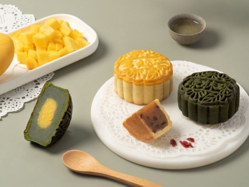 green mooncake and traditional mooncake on plate