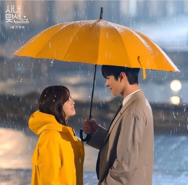 a business proposal yellow umbrella scene