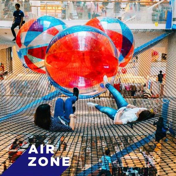 airzone singapore people playing with air balls on suspended net 