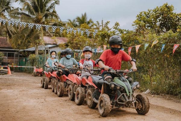 kids on atv ride at mud krank things to do in singapore with kids