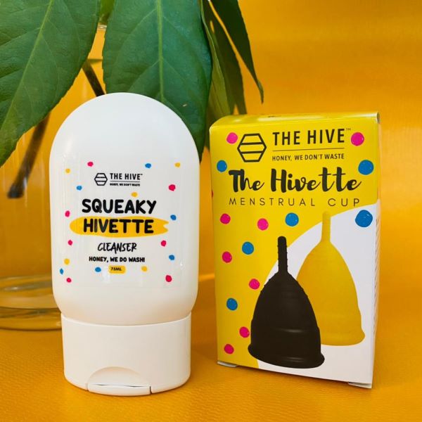 the hivette menstrual cup in black and yellow