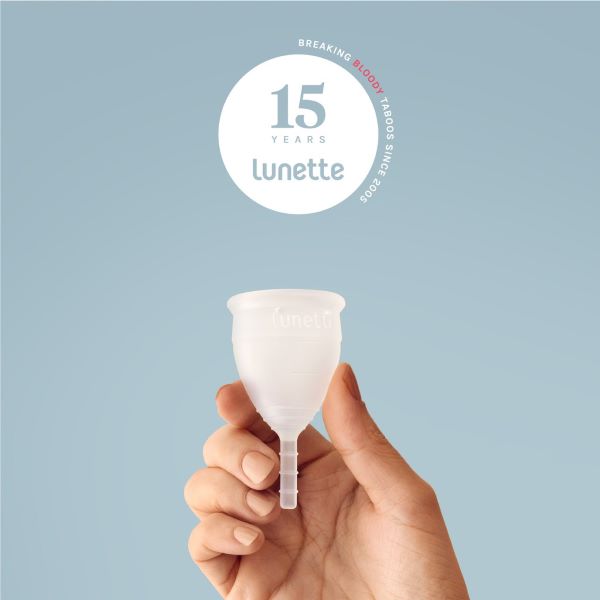 lunette clear menstrual cup over blue background