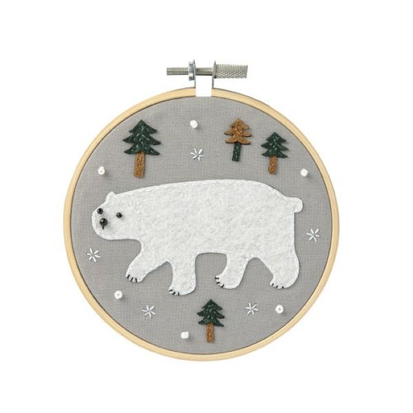 embroidery with polar bear design on grey background