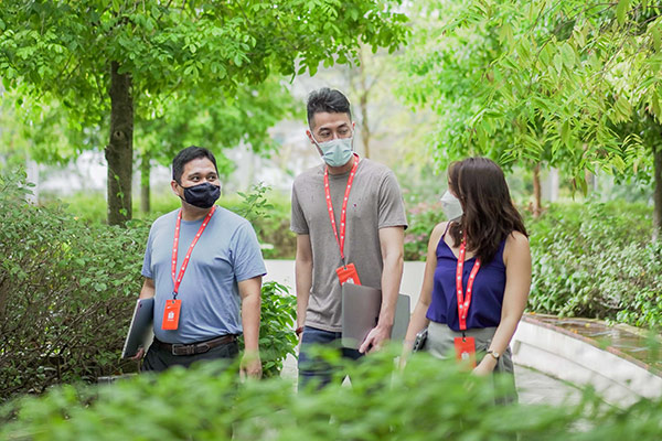 Ryan and Cuong with a colleague returning from an external meeting Shopee Engineer