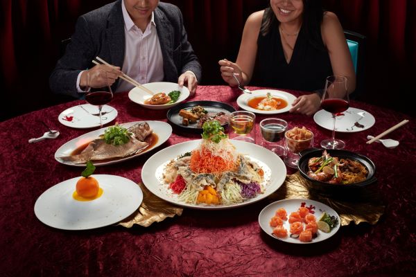 couple eating cny feast at madame fan best chinese restaurant singapore 2022 