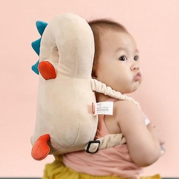 baby wearing baby head protector secret santa gift ideas