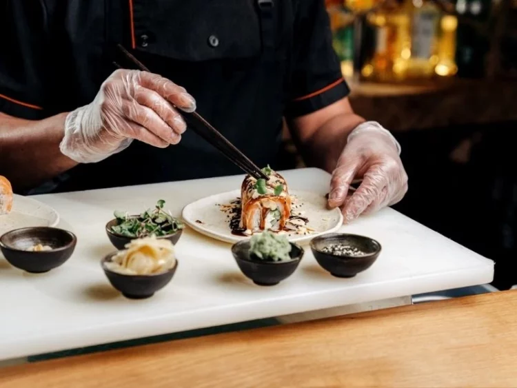 japanese chef preparing courses of sushi at the best omakase in singapore 2025