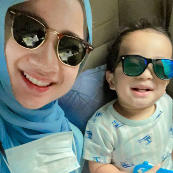 Mardhi and her son having a twinning moment in sunglasses