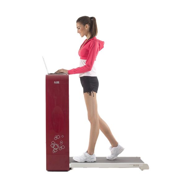 person walking on aibi tone desk treadmill red