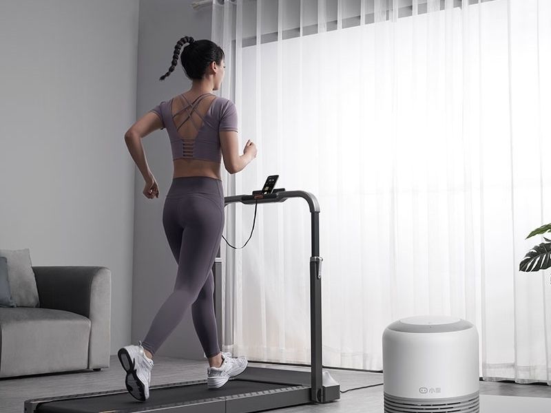 person running on a treadmill at home
