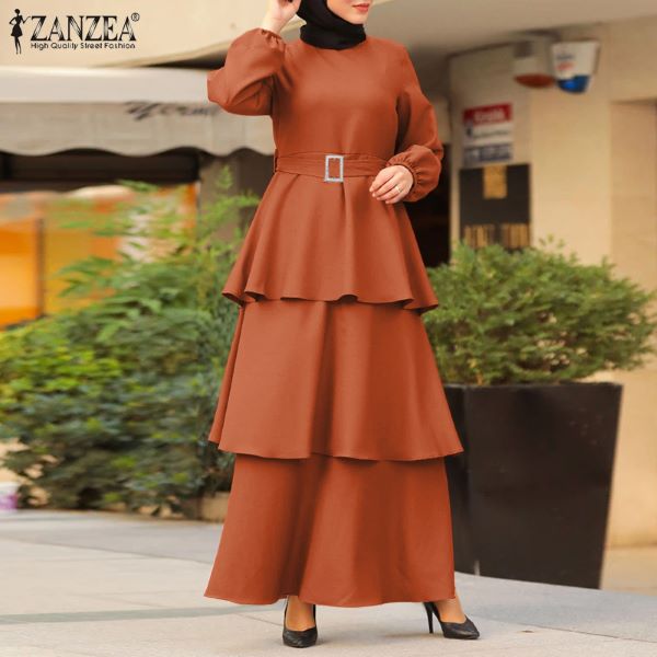 lady wearing brown ruffled maxi dress with belt and long sleeves modern baju kurung