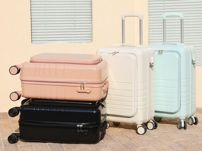 black, pink, white and blue luggage