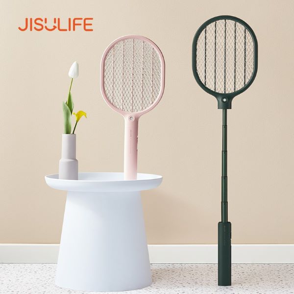 pink electric mosquito swatter on white table and green extended swatter best mosquito killer singapore