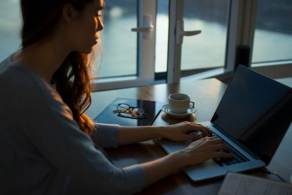 woman working on laptop at night eczema trigger what is eczema