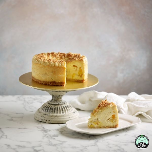 crumble cake with durian on a cake stand with a slice on a plate best durian cake singapore 2022
