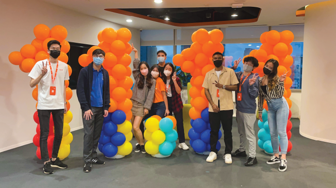 A Shopee intern and her team celebrating Shopee's 11.11 Big Sale Shopee work culture