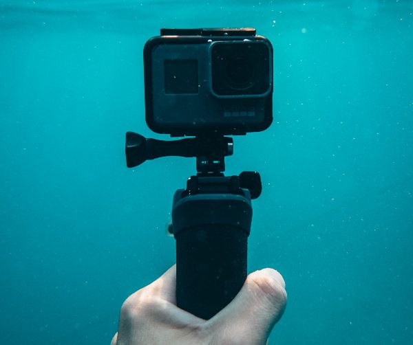 action camera on selfie stick submerged in water best action cameras singapore