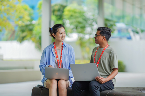 A Shopee Product Manager and Shopee Engineer in the Office having a discussion