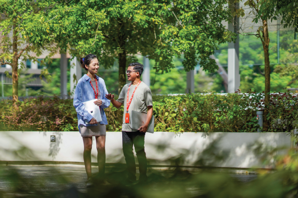 Qiaoyu and Achir enjoying a walk in the spaces near our office Shopee Product Manager Shopee Engineer
