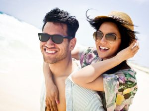 man woman sunglasses beach vacation fashion