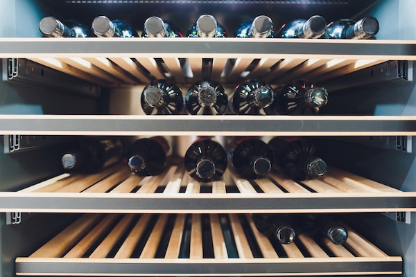 view inside a wine chiller with wooden racks