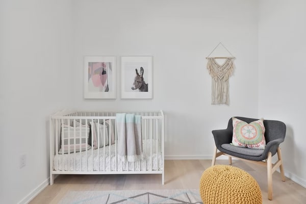 nursery with white baby cot 