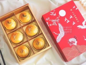 box of six shanghai mooncakes in a red box with prints