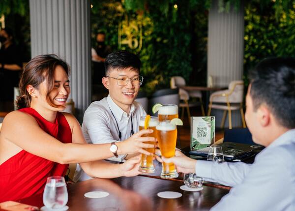 people saying cheers to beer at 1826 singapore