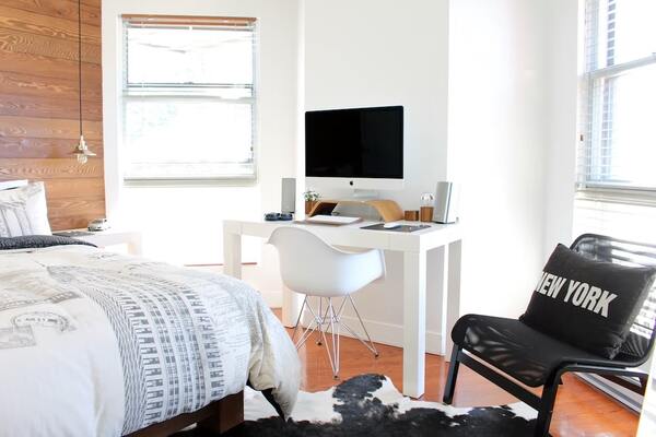 bedroom with macbook