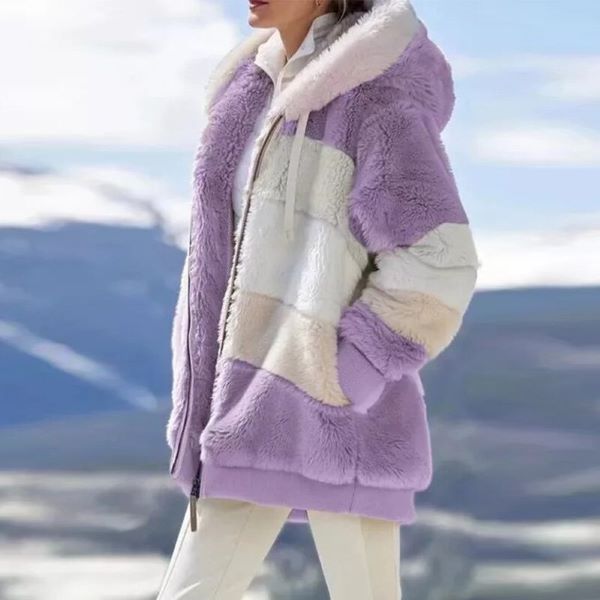 woman wearing purple fleece jacket on mountain