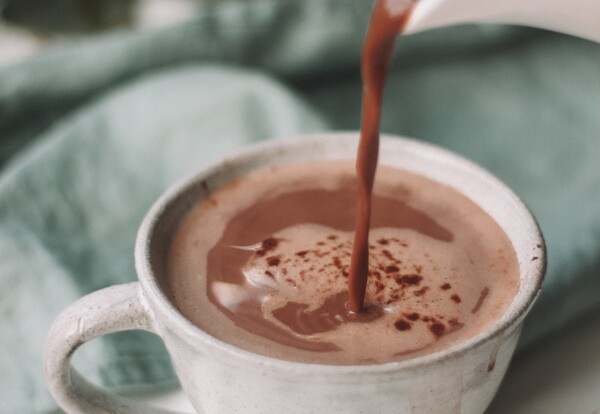 Pouring the best instant hot chocolate in Singapore into a mug