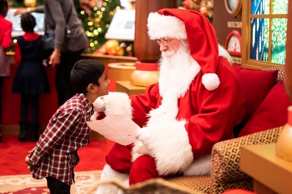 man in santa claus costume and a boy 