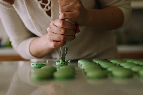 Pipping macarons at the best baking classes singapore