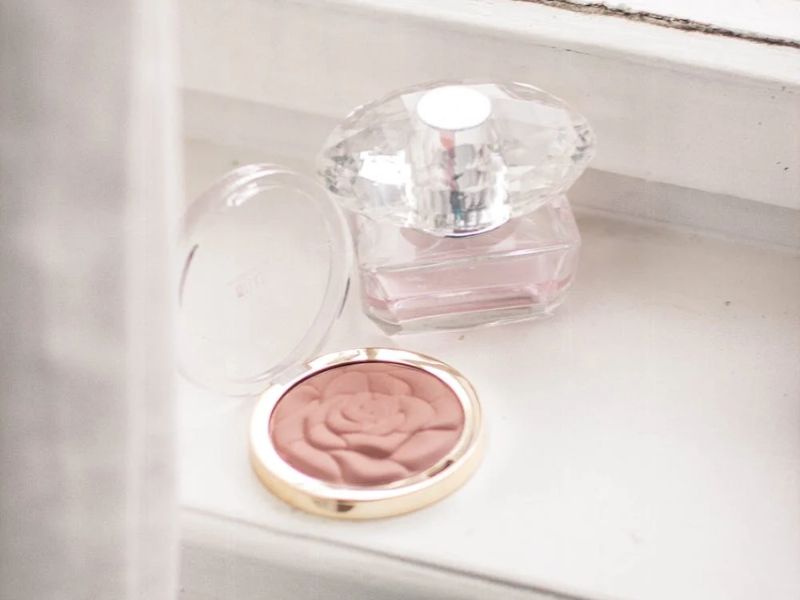 best blusher singapore milani blush compact petal design with a bottle of perfume