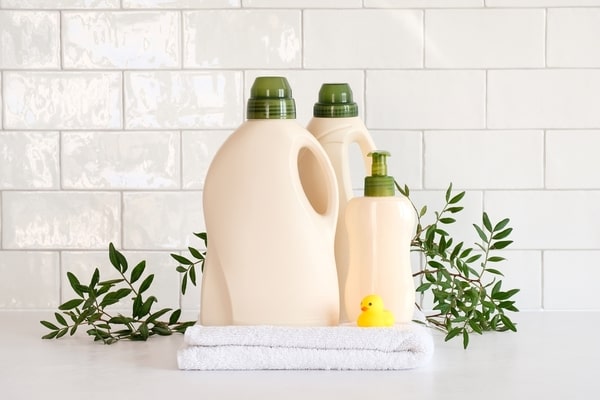 laundry detergent bottles with green caps