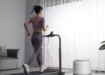 person running on treadmill at home