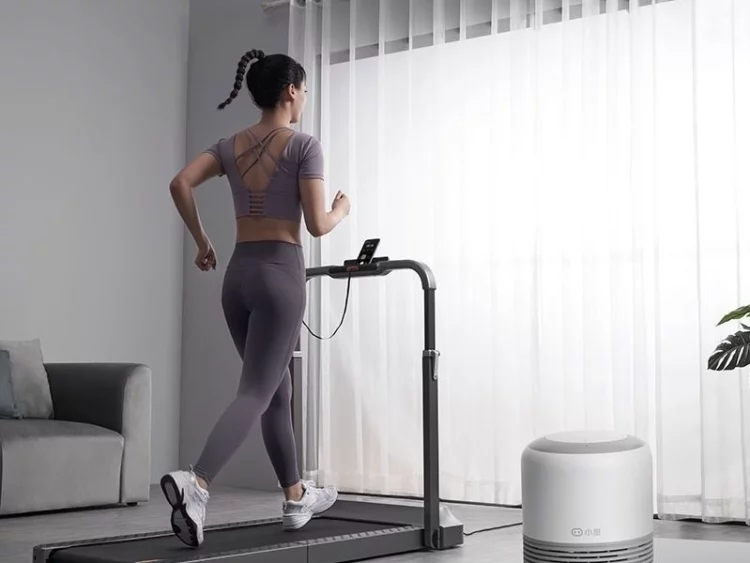 person running on treadmill at home