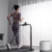 person running on treadmill at home